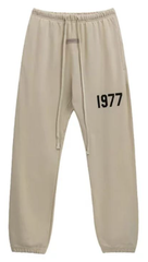 Fear of God Essentials Oatmeal Joggers with Black 1977 Graphic