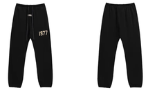 Fear of God Essentials Black Joggers with Beige 1977 Graphic