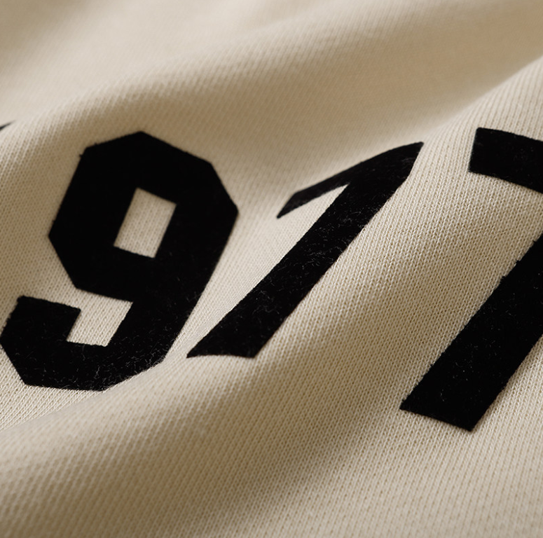 Fear of God Essentials Cream 1977 Flocked Shorts